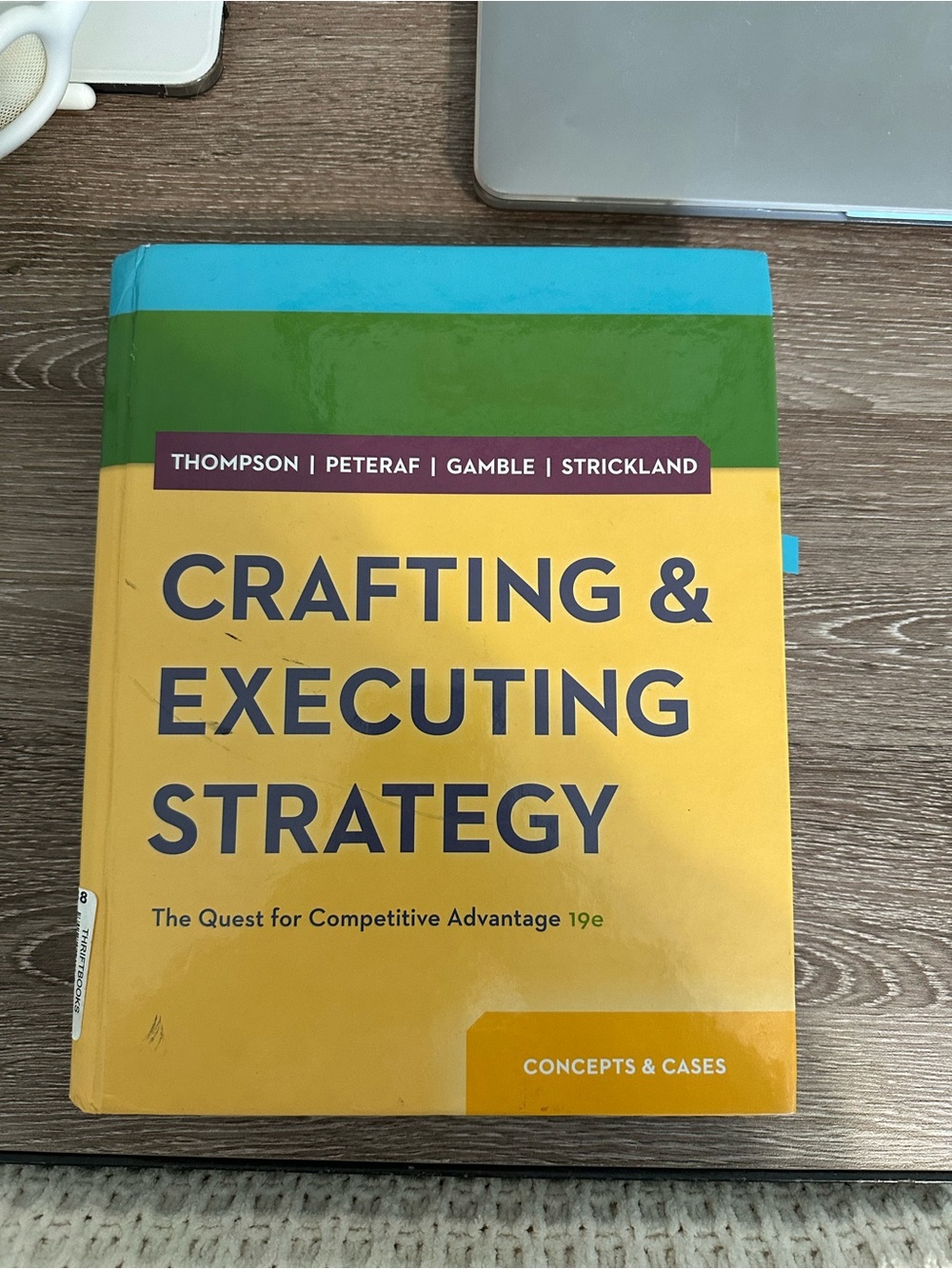 Crafting & Executing Strategy Textbook - Yellow & Green Cover
